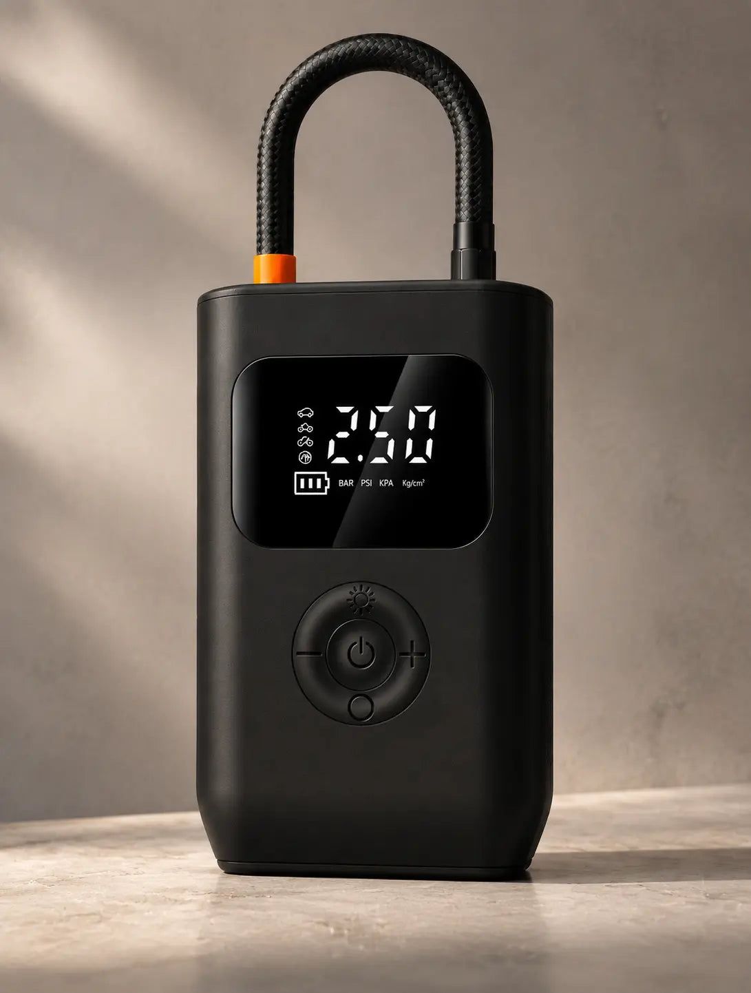Portable cordless tire inflator with digital pressure display, black compact design